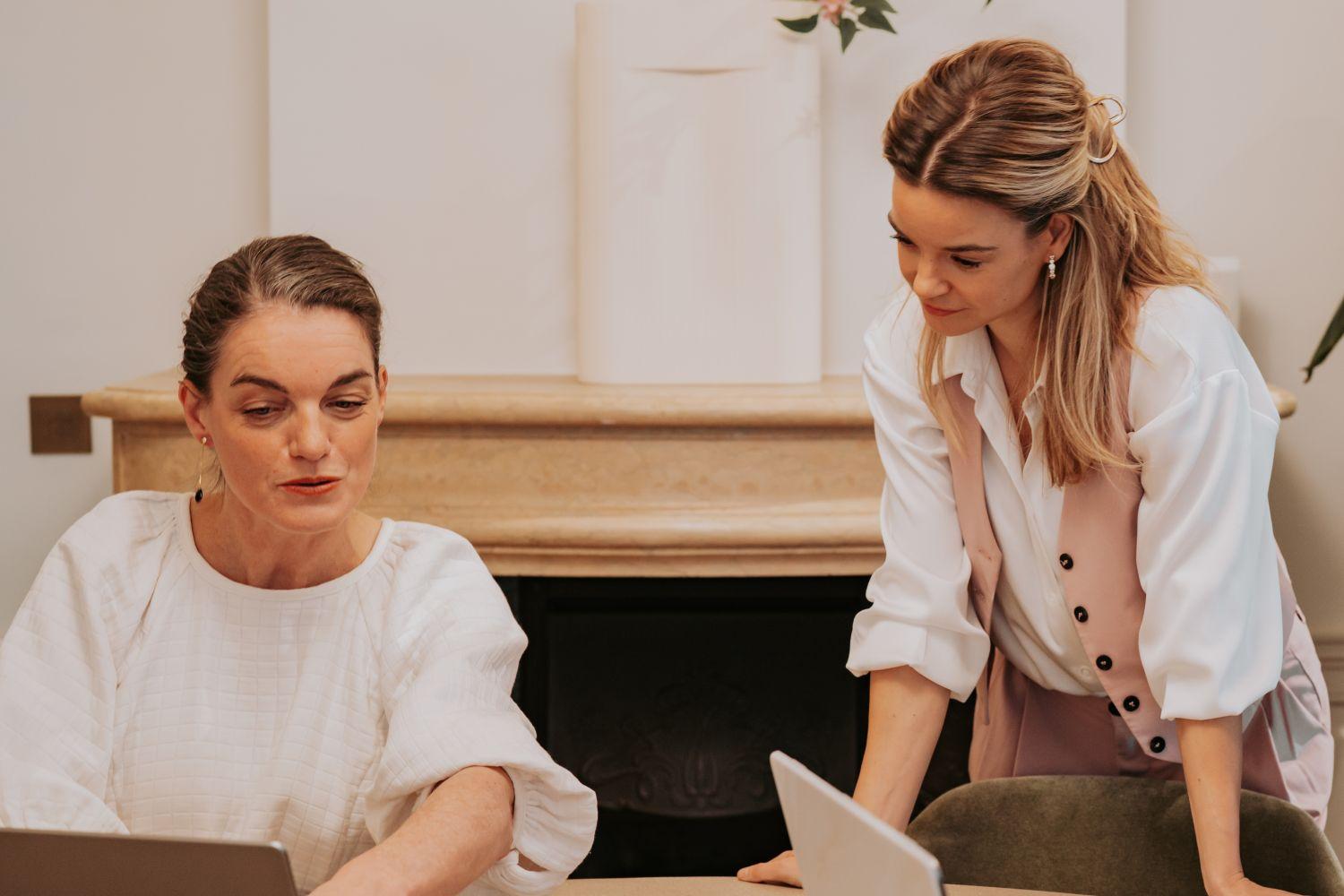 Anne Floor and Mireille reviewing content together