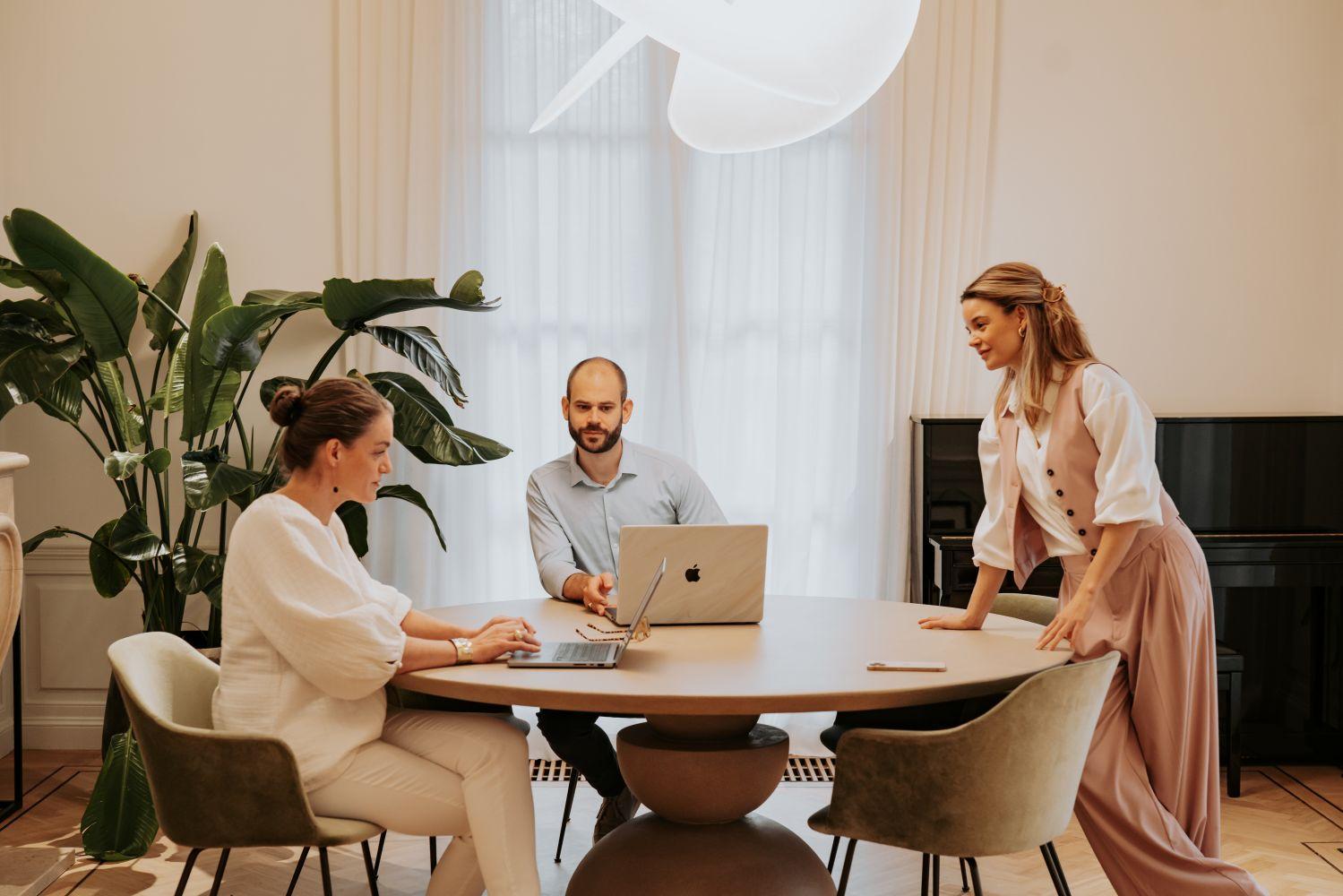 The Keendoc team working together around a table